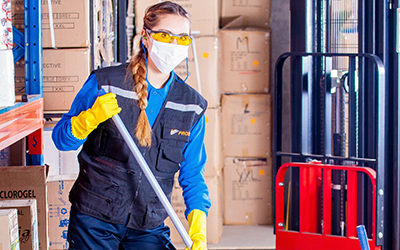 Woman wearing a mask and cleaning