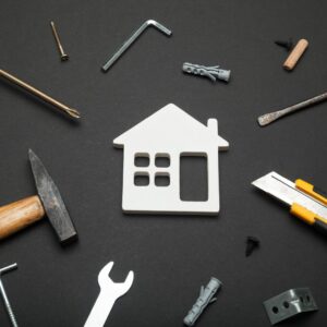 Cut out of a house and various tools. 