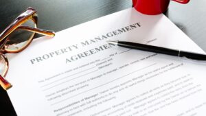 Paper that says "Property Management Agreement."