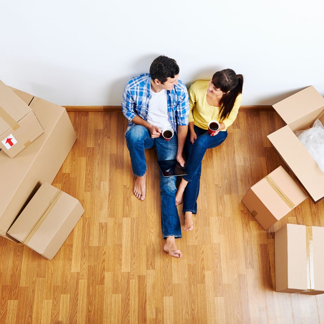 couple sitting on floor talking