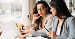 Two business professionals on a computer