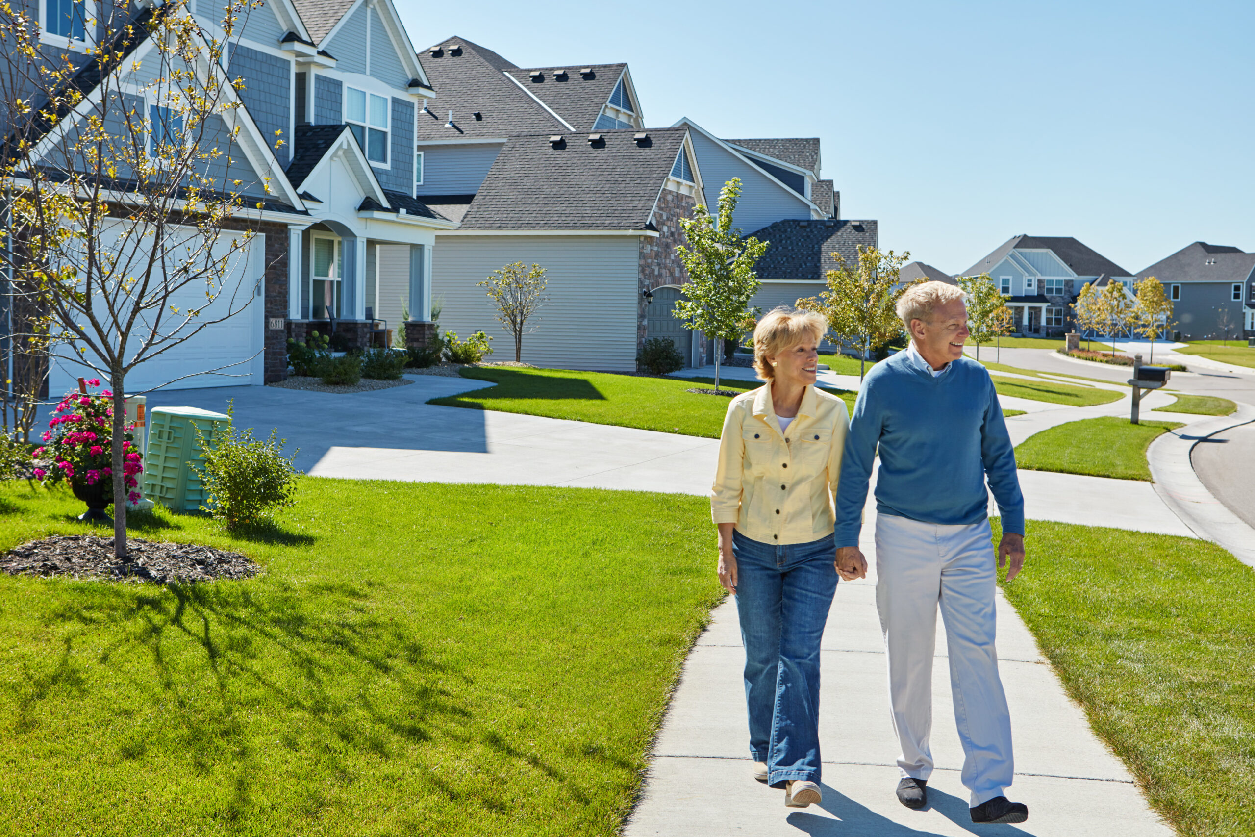 Shot of a happy senior couple waking around their neighborhood together