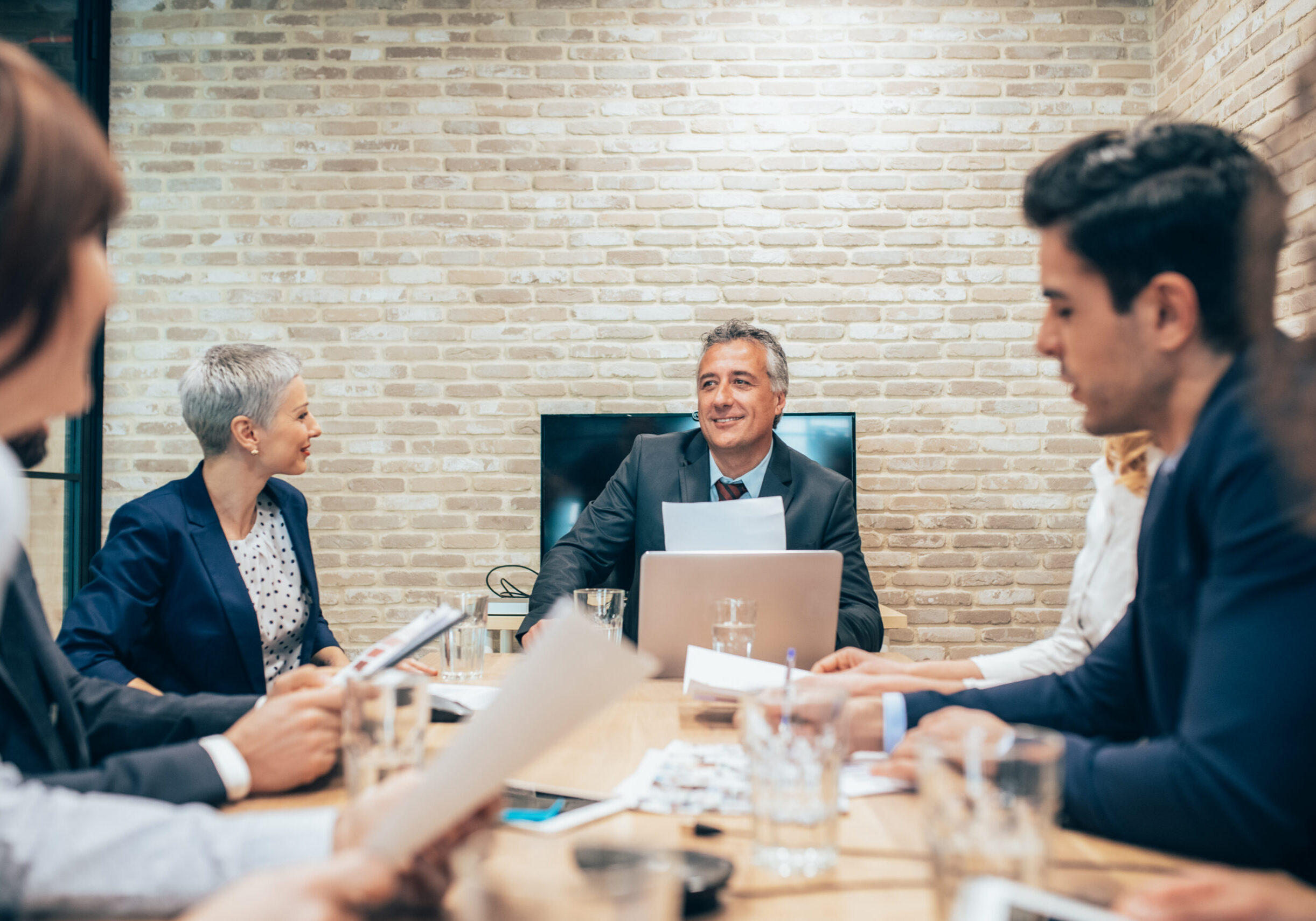 Multiracial group of business people having a meeting. Business team discussing good ideas in conference room. Senior managers making new business strategy